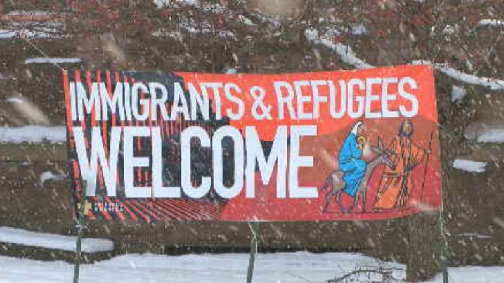Albion church banner refugees, immigrants WHAM