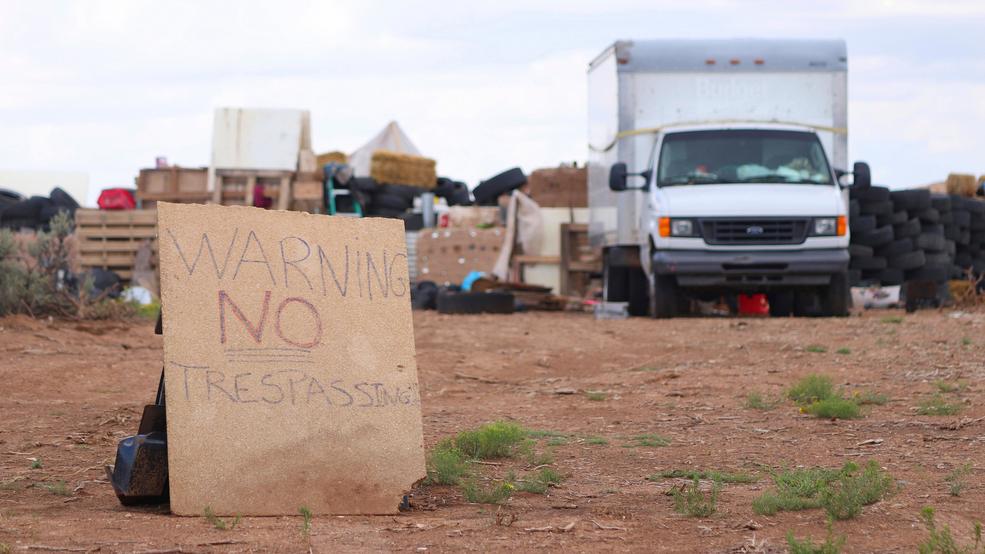 Compound Search Children Removed New Mexico compound desert sign AP875.jpg