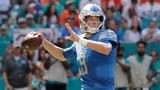 Johnson's 158 yards rushing help Lions beat Dolphins 32-21